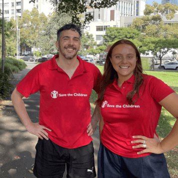 Male and Female both wearing a red t-shirt with the Save The Children logo